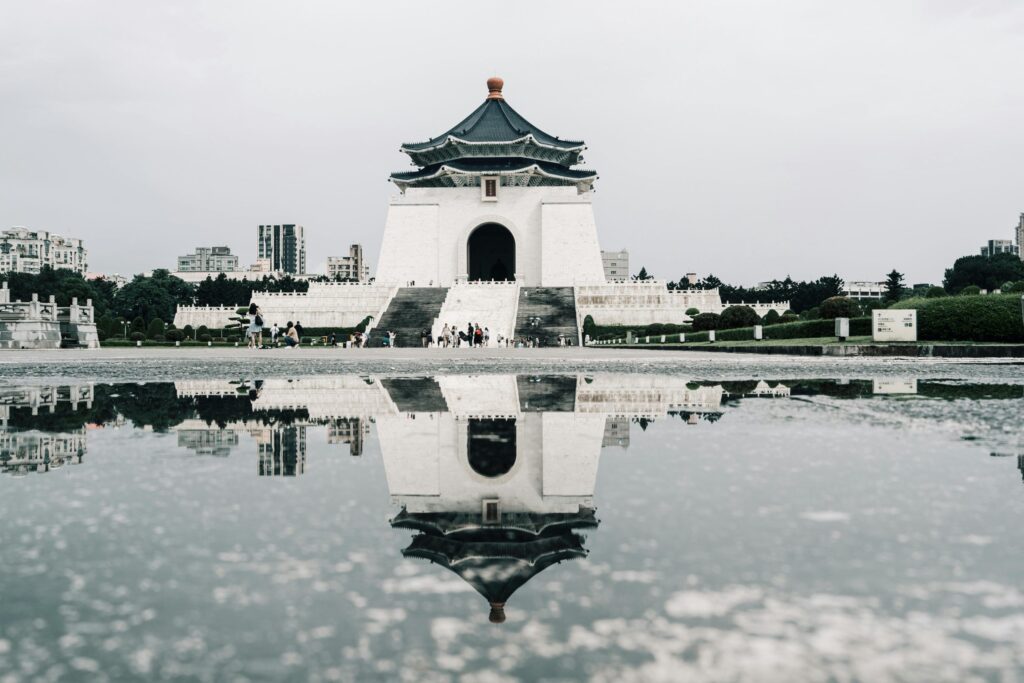 Liberty Square arch and its reflection in Taipei.